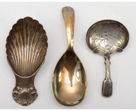 Three silver tea caddy spoons to include a William IV example with thistle decoration, by Joseph Willmore, Birmingham 1836, 4