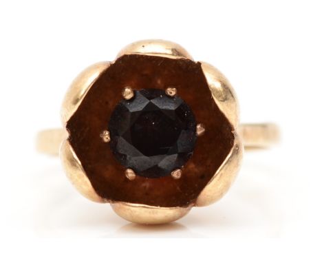 A 9ct gold single stone garnet flower ring, K-L, 3.3gm. 