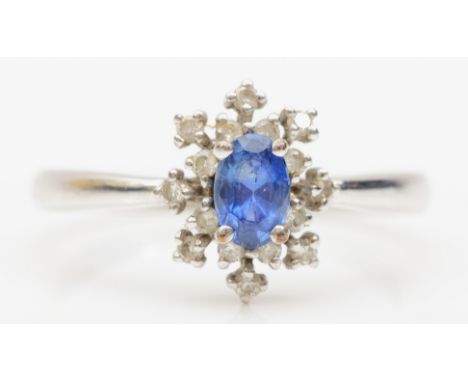 A 9ct white gold sapphire and diamond cluster ring, R, 2.5gm. 