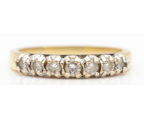 A 9ct gold seven stone brilliant cut diamond dress ring, K, 1.8gm. 