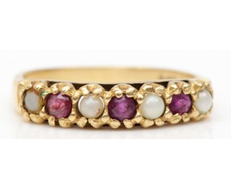 A 9ct gold ruby and seed pearl dress ring, Q, 2.3gm. 