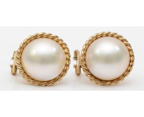 A 9ct gold gold cultured pearl clip and post earrings, with rope twist boarder, 16mm, 8.4gm. 