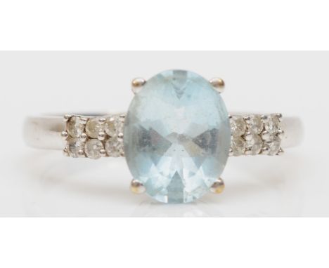 A 9ct white gold aquamarine and brillaint cut diamond dress ring, R, 3.2gm. 