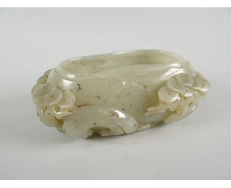 A carved jade brush pot, 11.4cms long Condition reports are provided on request by email only for this type of auction, other
