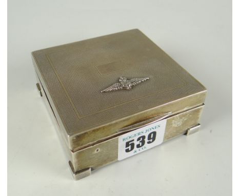 A square engine-turned silver RAF crest mounted cigarette box, Birmingham 1939 Condition reports are provided on request by e