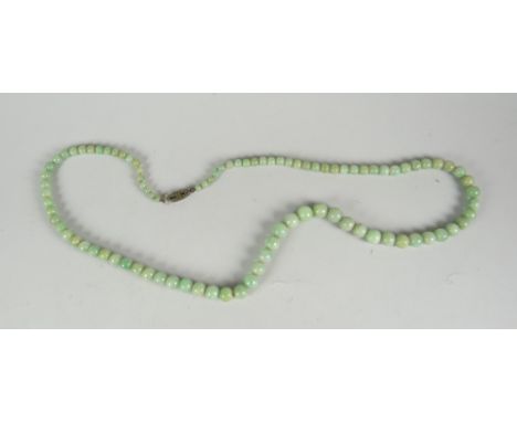A strand of jade beads Condition reports are provided on request by email only for this type of auction, otherwise purchase '