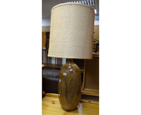 A mid to late twentieth century oversized sgraffito pottery table lamp with shade Condition reports are provided on request b