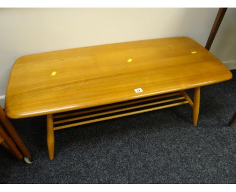 A good Ercol blonde two-tier Long John coffee table Condition reports are provided on request by email only for this type of 