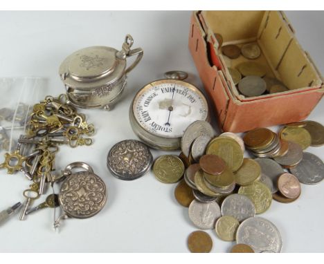A parcel of loose coinage, pocket barometer, parcel of pocket watch keys ETC Condition reports are provided on request by ema