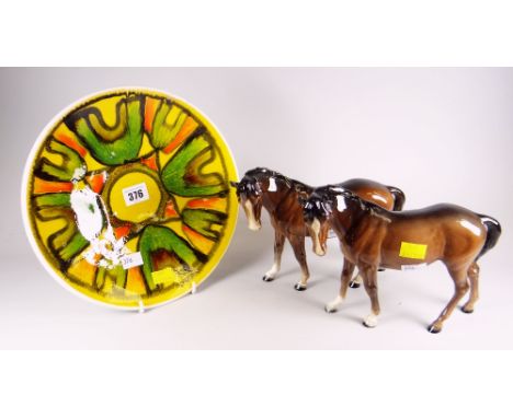 Two Beswick standing horses &amp; a Poole flambe-style yellow ground plate Condition reports are provided on request by email