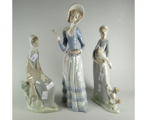 A Lladro figure of a lady with goose &amp; puppy, a Lladro figure with a lady in parasol (damage) &amp; a Nao figurine Condit