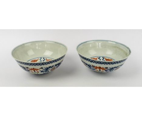 CHINESE DOUCAI ENAMELED BOWLS, a pair, underglaze blue with foliate enamel decoration character mark to base, 17cm D x 7cm H.