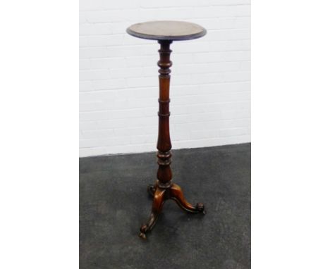 Mahogany torchere, the circular top on baluster column and tripod legs