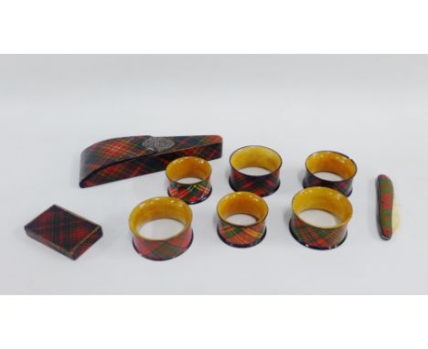 Group of late 19th century Mauchline 'Tartan Ware' to include six napkin rings, a letter opener,  scissors case and a snuff b