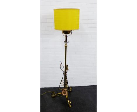 An early 20th century brass and copper standard lamp and shade, 180cm