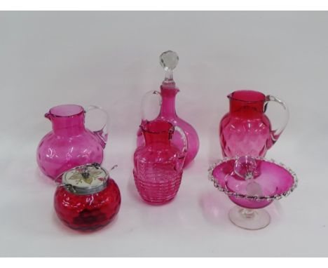 Collection of Victorian cranberry glass to include a decanter and stopper, water jugs, bowl, preserve jar and cover, (6) 