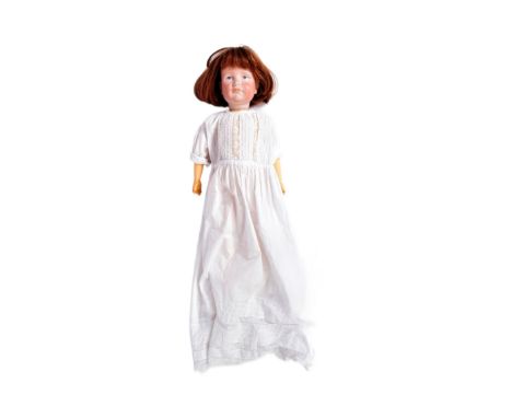 An early 20th Century German ' Kammer &amp; Reinhardt ' bisque headed doll with a replacement composition body. Painted blue 