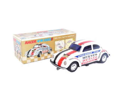 Tinplate Toys - a vintage Japanese (Taiyo) tinplate battery operated Volkswagen Racer 1303S with Bump N Go action and engine 