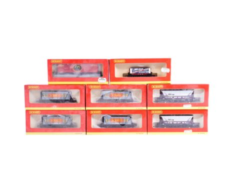 A collection of x8 Hornby OO gauge model railway trainset locomotive rolling stock wagons, comprising of x4 R6177 9 Plank Wag
