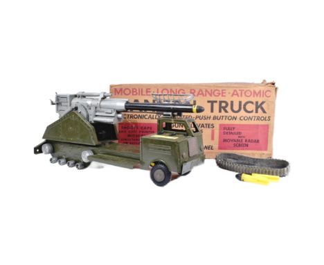 An original vintage Louis Marx made large scale battery operated tinplate toy ' Mobile Long Range Atomic Cannon Truck '. The 