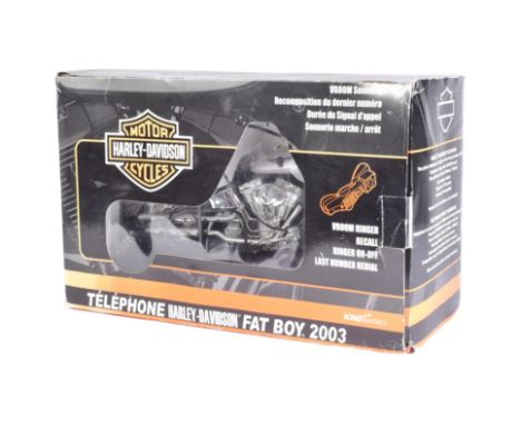An official Harley Davidson licensed ' Fat Boy ' novelty telephone. Two piece model operated by lifting the seat to answer. B