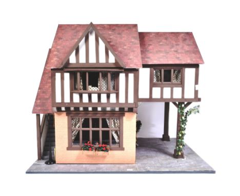 Dolls House - a hand built scratch built wooden dolls house in the style of a traditional tudor manor. Two storey example com
