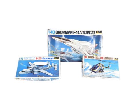 Three vintage Fujimi model kits of aircraft plane and helicopter interest. Comprising of; 1 /48 scale Grumman F-14A Tomcat, 1