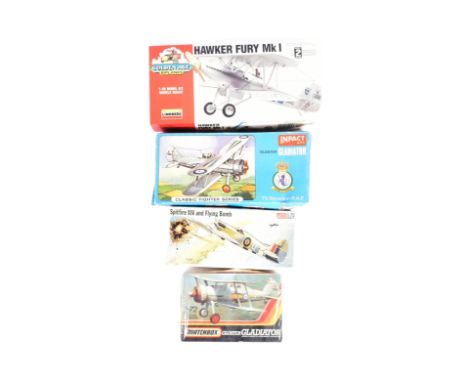 A collection of four vintage plastic model kits of WW2 World War Two aircraft and plane interest, from a variety of makers. C