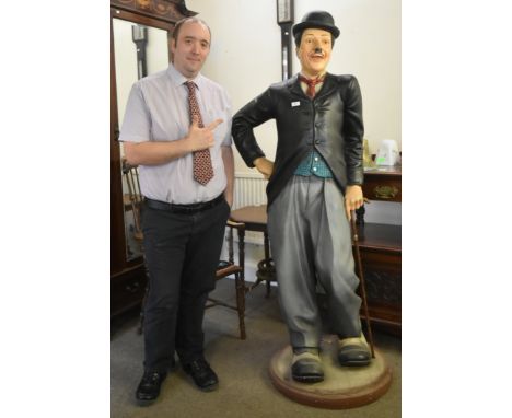 Charlie Chaplin - a large lifesize 1/1 scale statue of Chaplin, depicted in his trademark suit with bowler hat. Fibreglass co