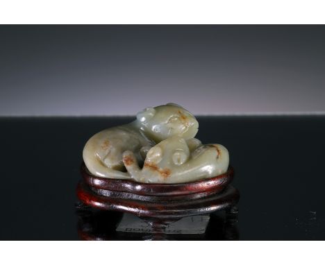 JadeChina, Qing DynastyDimensions: Height 4 cm with base by 6,5 cmWeight: 89,3 grams without baseSmall jade carving of two ba