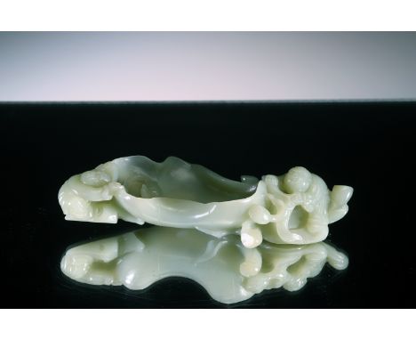 Greyish-Green Jade China , 18th to 19th centuryDimensions: Height 1,5 cm by 15 cmWeight: 181,4 gramsAmusingly carved as a lar