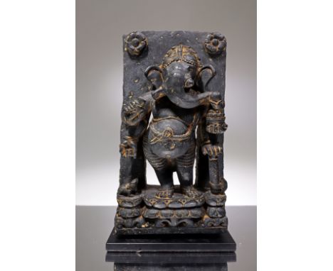 Black Stone India , 18th century or earlier Dimensions: Height 31 cm by 17 cm without base Weight: 8662 grams with base Stone