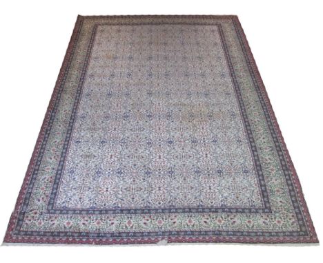 ANTIQUE FINE ANATOLIAN CARPET, 340cm x 240cm, allover flower head and vine design on an ivory field within corresponding guar