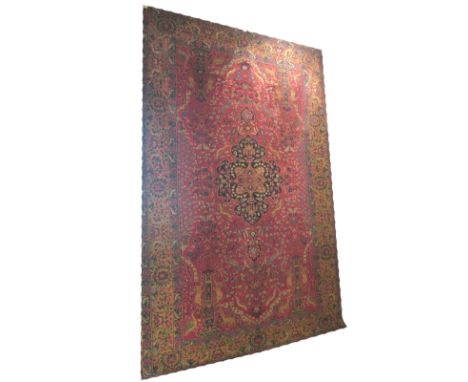 ANTIQUE TABRIZ CARPET, 290cm x 195cm, midnight blue pendant medallion on a ruby field of foliage and animals within an old go