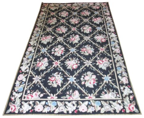 AUBUSSON TAPESTRY, 240cm x 147cm, floral bouquets on a noir field within corresponding border. 