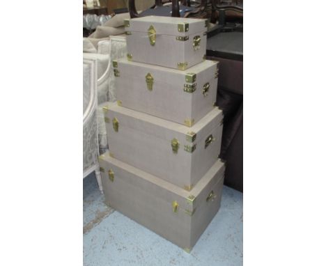 TRUNK, graduated set of four, in a faux shagreen finish with brass mounts, largest 68cm x 42cm x 41cm H. (4)