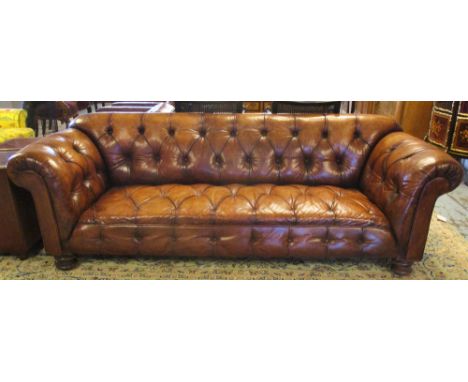 CHESTERFIELD SOFA, vintage buttoned tan leather upholstered with turned feet, 234cm x 87cm.