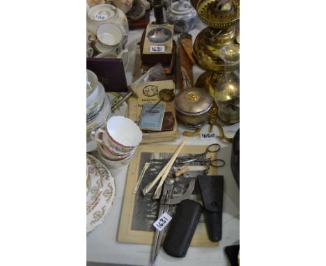 Ephemera - a students microscope (faults); a Bible with pressed leaves; a St. Christopher car badge; a clock pendulum; glove 