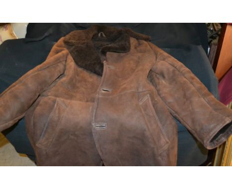 A Gentleman's lambswool brown jacket; other textiles; Audi overalls; etc  **All lots in this sale are subject to a maximum of