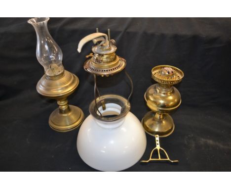 A brass oil lamp, opaque white glass shade, flue; another lamp base only;   **All lots in this sale are subject to a maximum 