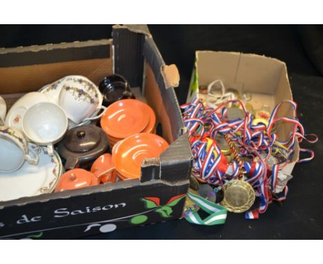 An early 20th century Continental part coffee service, boldly glazed in lustred orange, comprising coffee pot, milk jug, suga