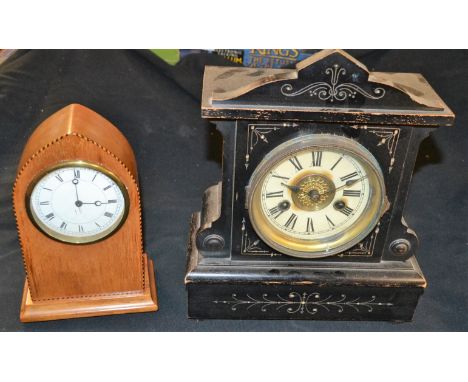 A 20th century pointed arched mantel clock; a late 19th century ebonised mantel clock (2)  **All lots in this sale are subjec