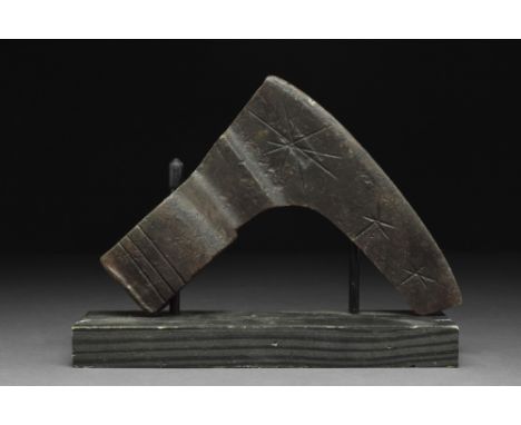 Ca. 900-1100 AD.An iron bearded axe head with an elongated, heavy blade and a round socket. One side of the blade features an