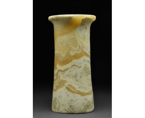 Ca. 2nd millennium BC.A beautiful vessel of a slender, cylindrical form with a flat base, tall walls, and a thick rim surroun