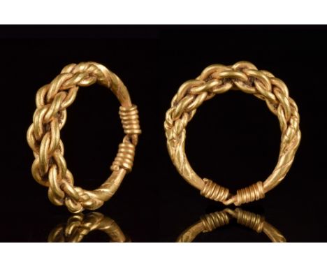 Ca. 900-1100 AD.A superb heavy gold ring comprised of a twisted band with wrapped terminals. This ring was intended to evoke 