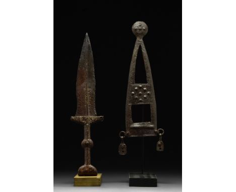 Ca. 100 AD.An iron pugio, or squat triangular dagger with prominent midrib and narrow, flat guard and an integral handle with