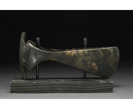 Ca. 900-1100 AD.A forged-iron axe head with a perforated socketing shaft, a dense neck, and a vertically oriented blade with 