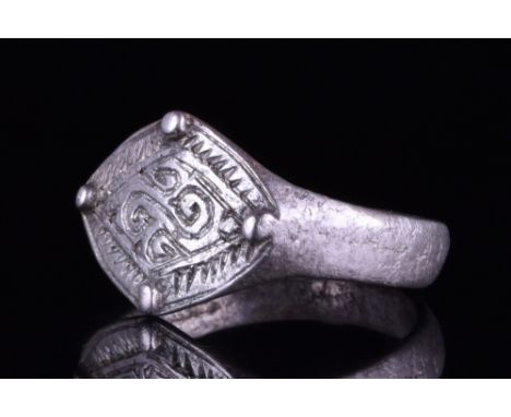 Viking Age, Ca. 900-1100 AD.A beautifully decorated silver ring comprising a circular hoop, and a lozenge-shaped bezel featur