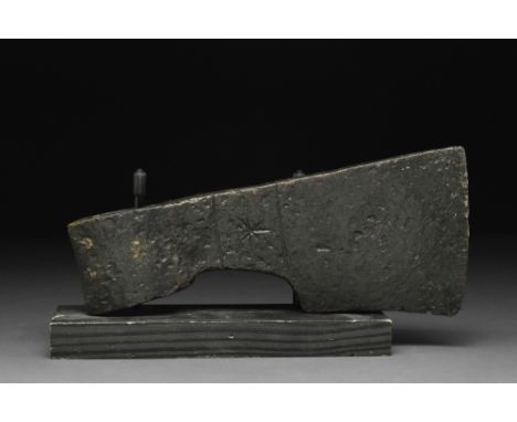 Ca. 900-1100 AD.An iron axe head comprising a wedge-shaped blade, tapering cheek, reinforced poll, and rounded socket. The ch
