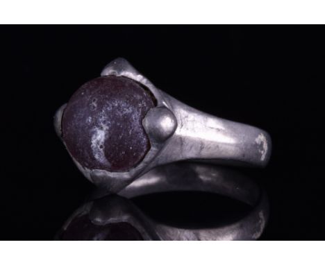 Northern European, Ca. 1000-1200 AD.A silver finger ring comprising a flat-section hoop, slightly flaring at the shoulders, a